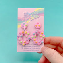 Load image into Gallery viewer, Pastel pink and rainbow oval polymer clay stud earrings